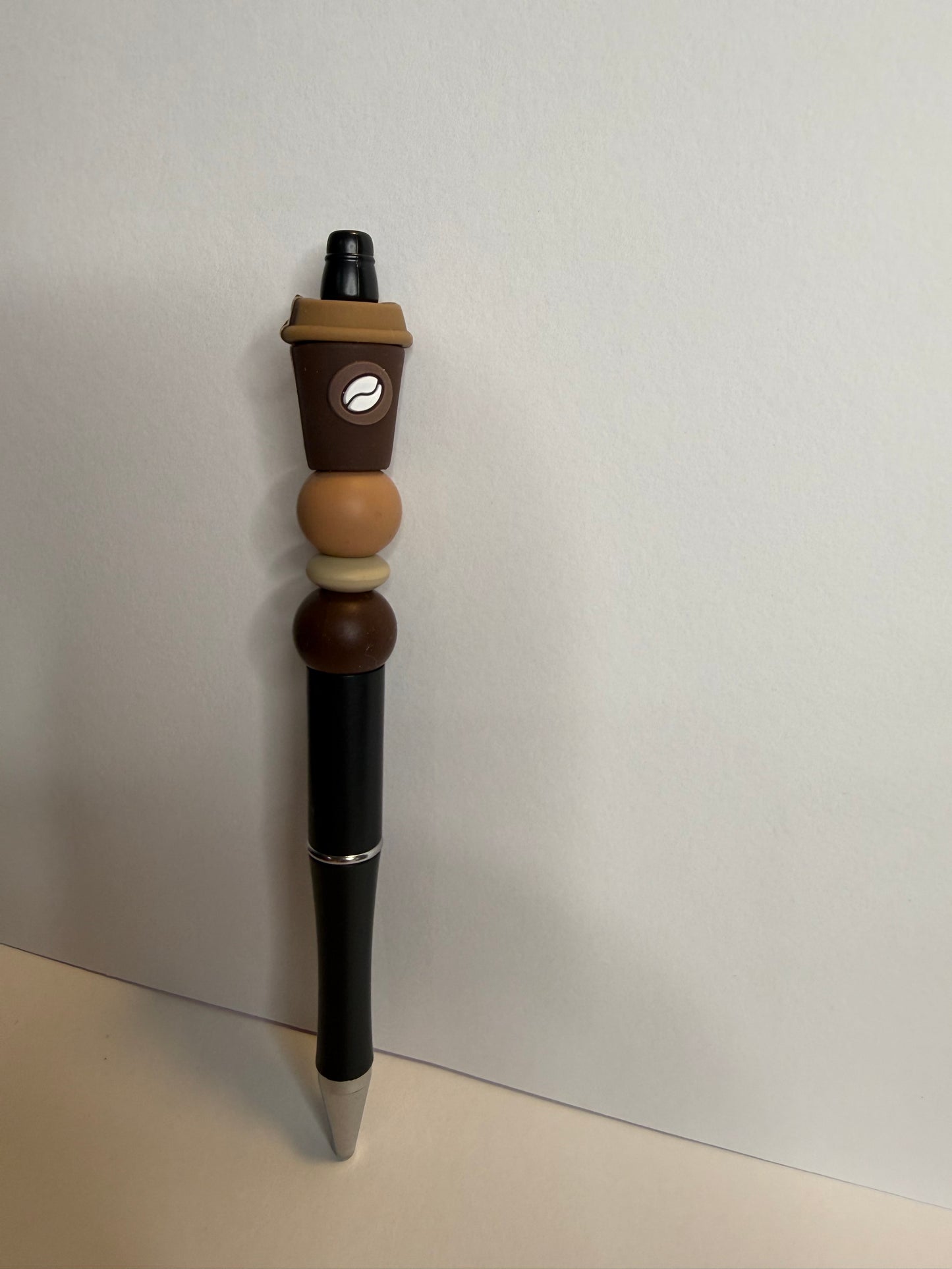 Coffee cup on black premade pen