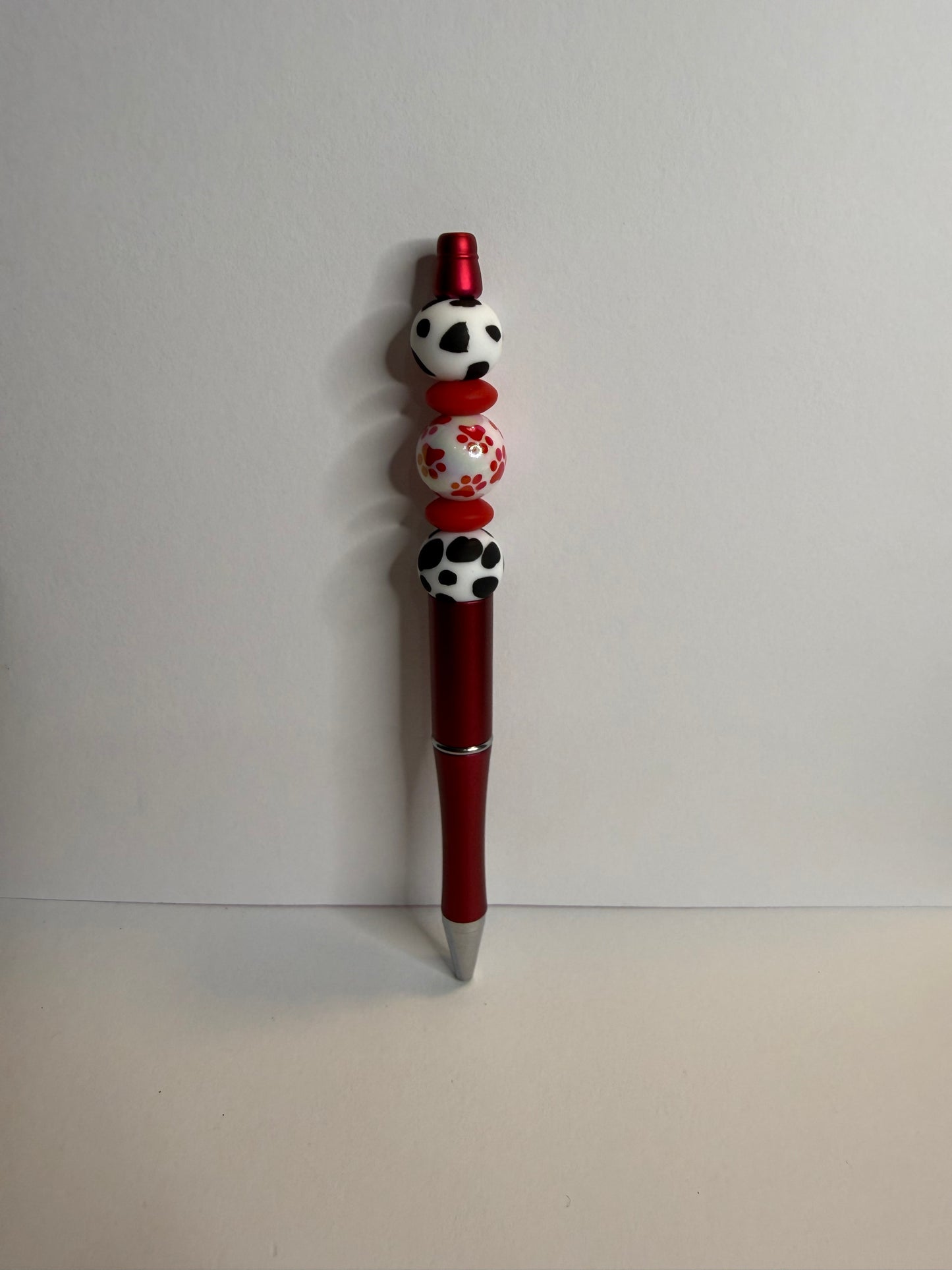 red paw print with b&w on red pen premade pen