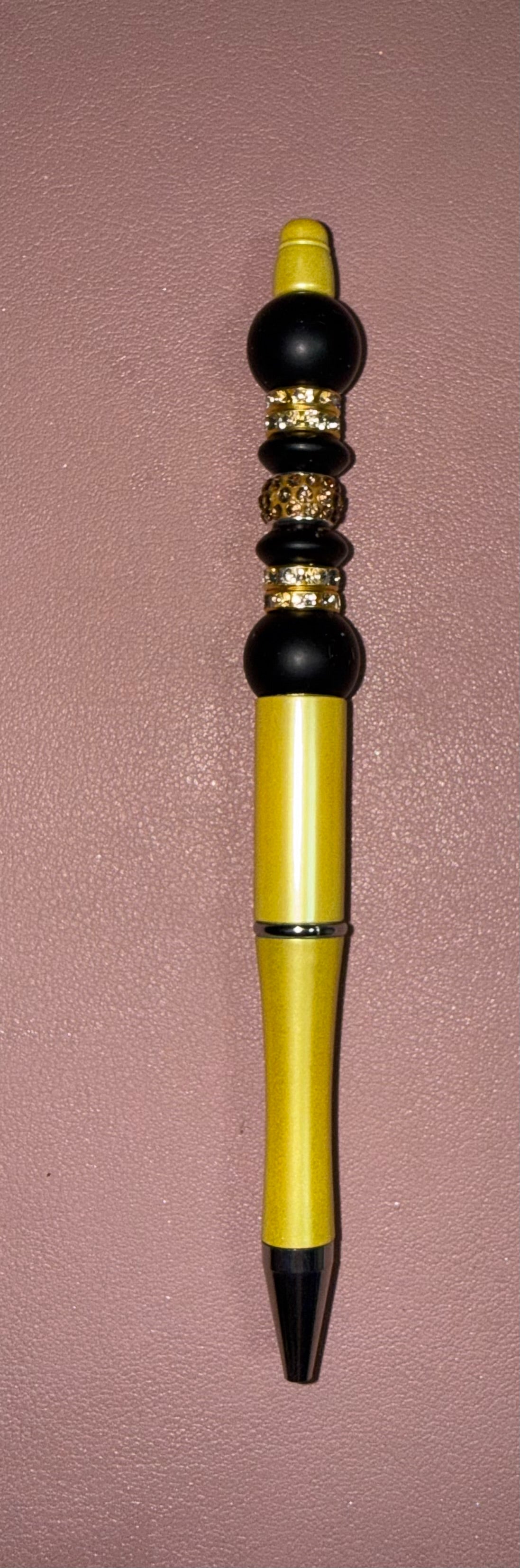 yellow, black and gold premade pen