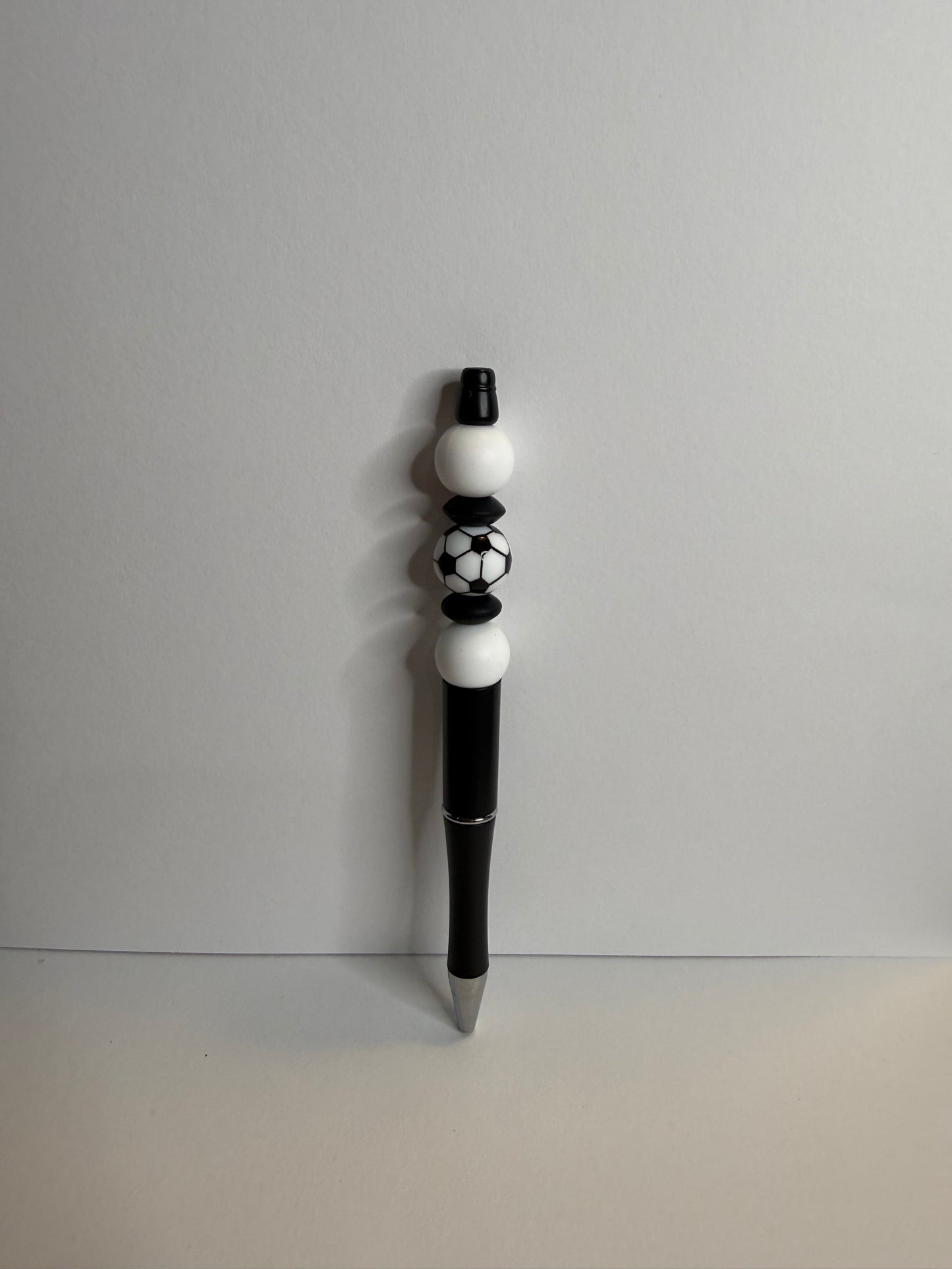 soccer ball on black premade pen
