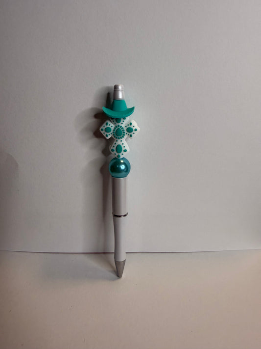 white and teal cross on white premade pen