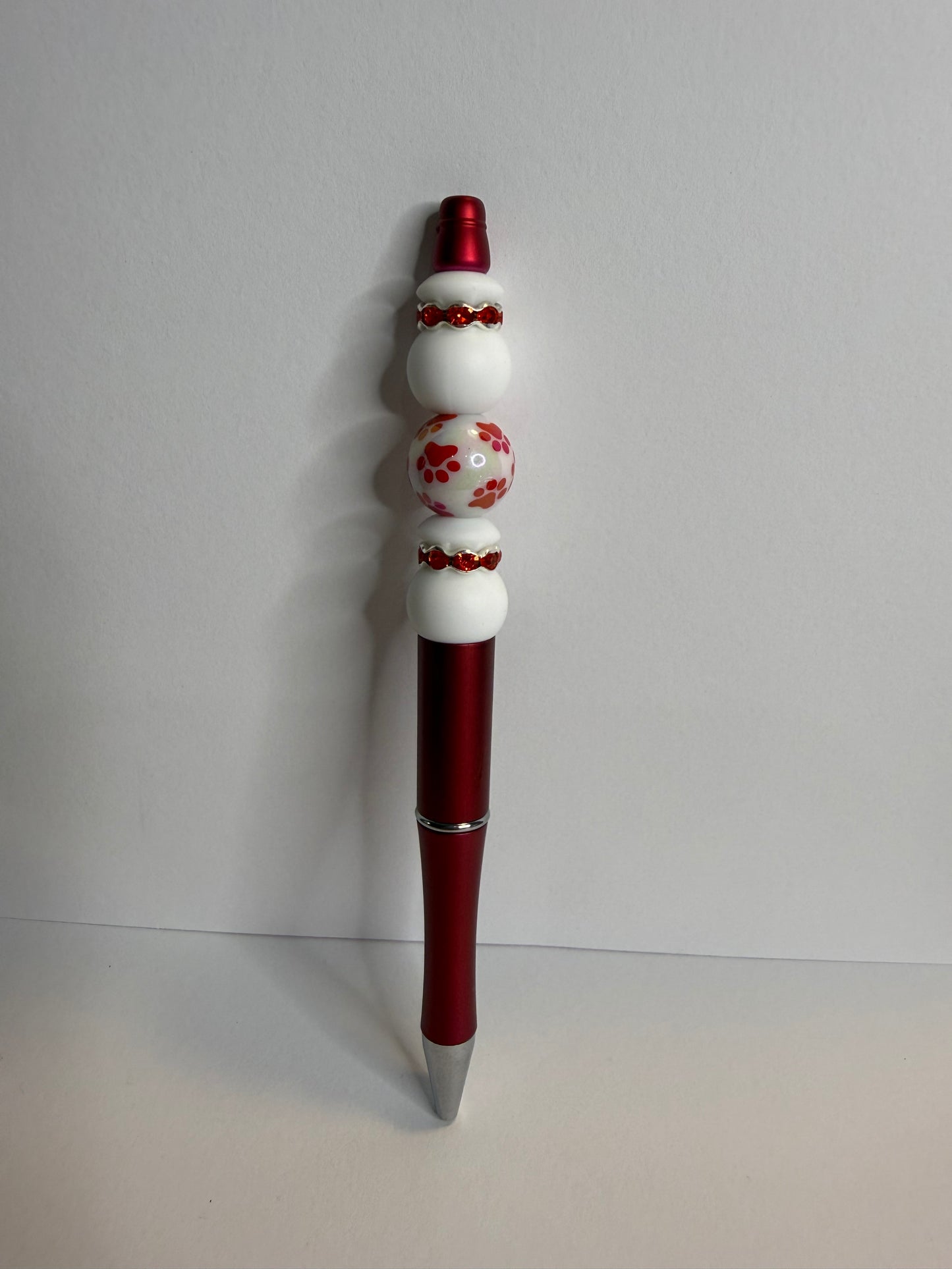 red paw print on red pen premade pen