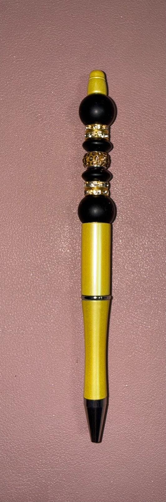yellow, black and gold premade pen