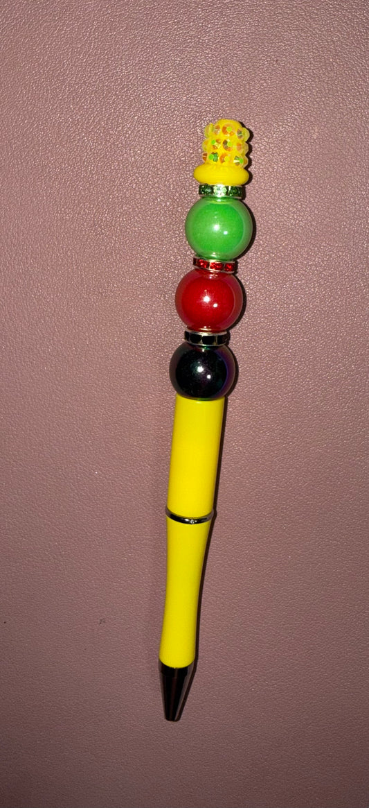 yellow pen with red, black, and green beads premade pen