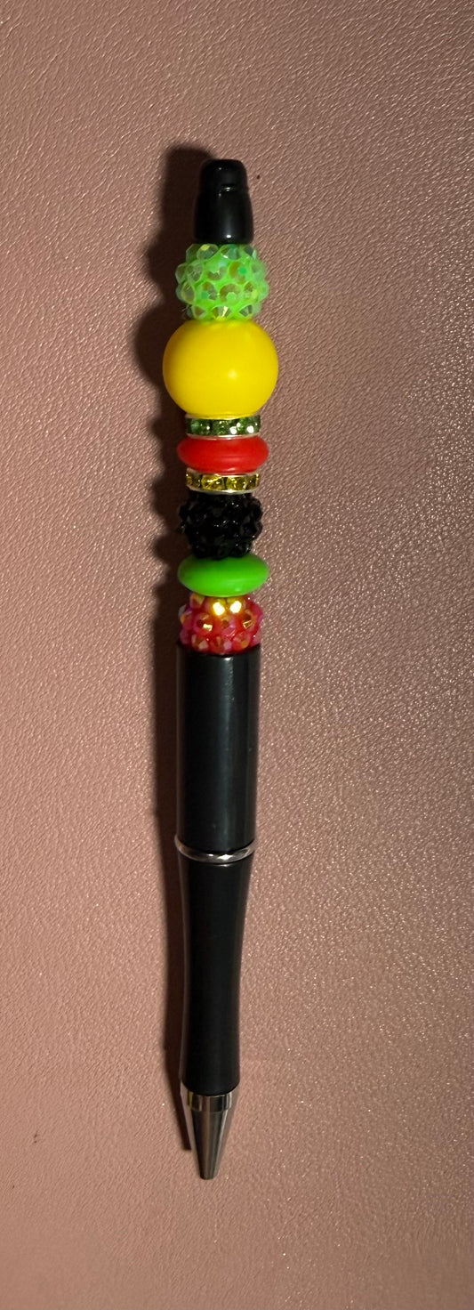 black, yellow, green, and red  premade pen